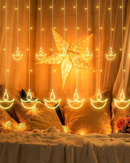 Homesake® 12 Diya Curtain Fairy String Led Diya Light with Plug in String Lights with 8 Modes, Diwali, Christmas Festive Lights, Pooja Room Decor for Indoor Outdoor Window Wall Home Party (Warm White)